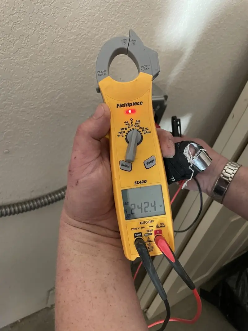 Voltage testing with clamp meter during Electrical Installation Services in Westfield